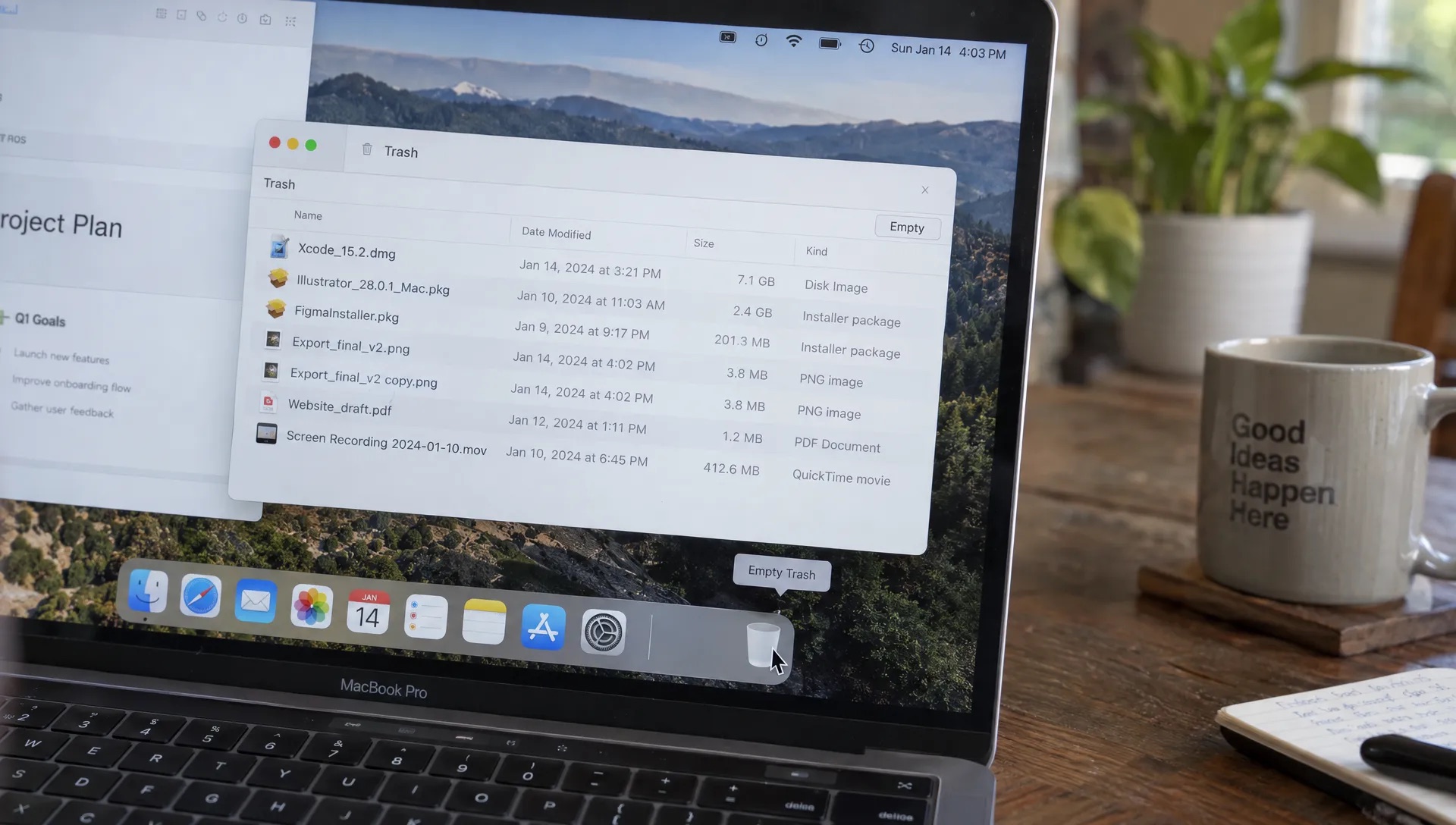 A MacBook Pro shows reviewed installers and duplicate exports in Trash before they are permanently removed during a disk cleanup.